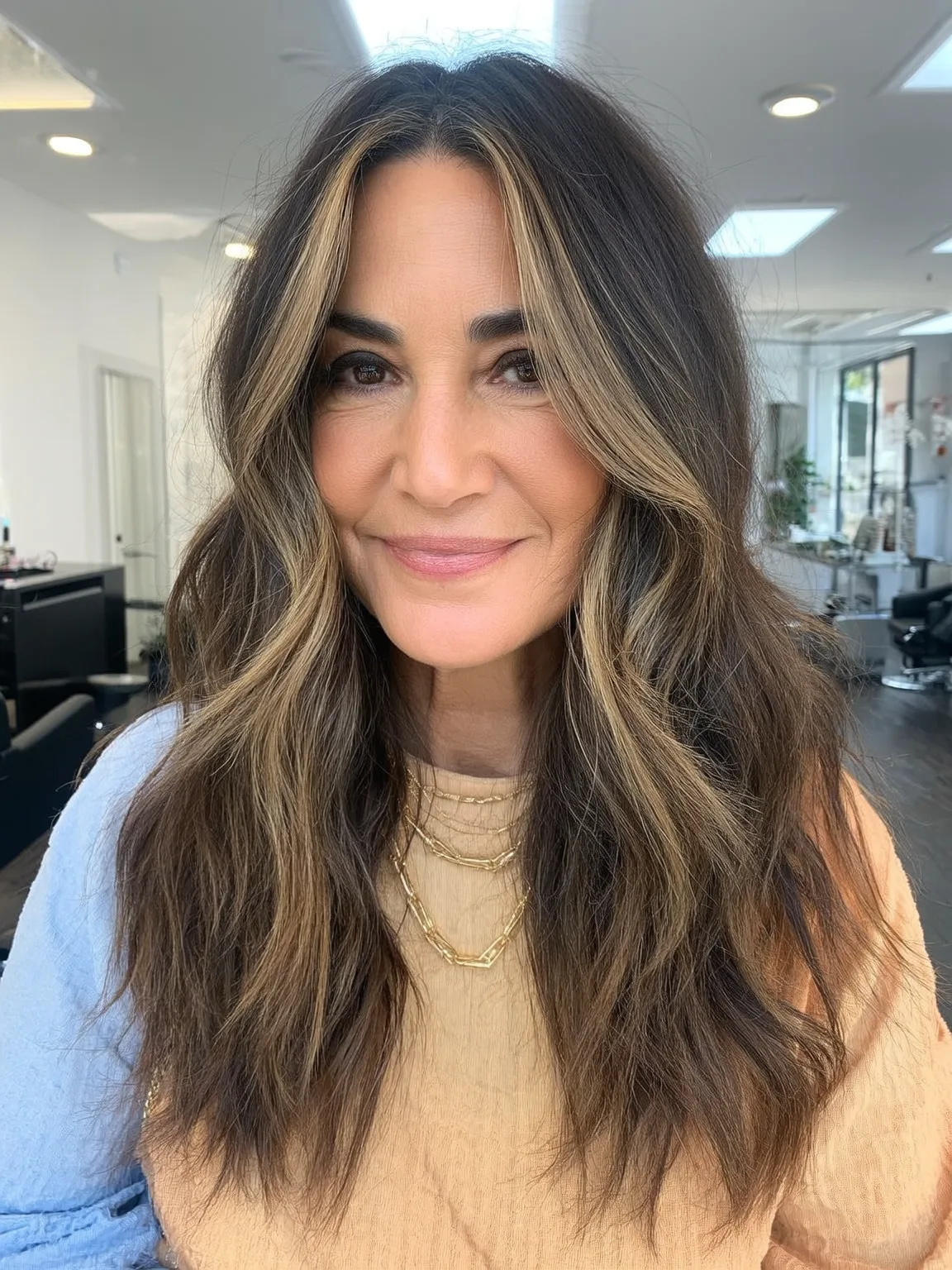Voluminous Textured Layers with Caramel Highlights on Brunette